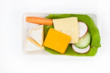 Cheese plate with fresh vegetables